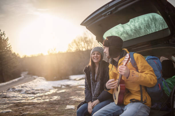 istock Yong couple with guitar in car trunk 1257337872