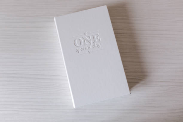 istock White box for printing photo. Box with lettering on white wooden table 1257337923