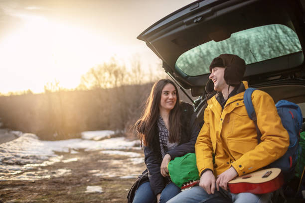 istock Yong couple with guitar in car trunk 1257337957