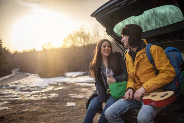 istock Yong couple with guitar in car trunk 1257337984