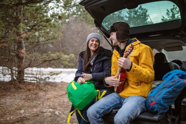 istock Yong couple with guitar in car trunk 1257338238
