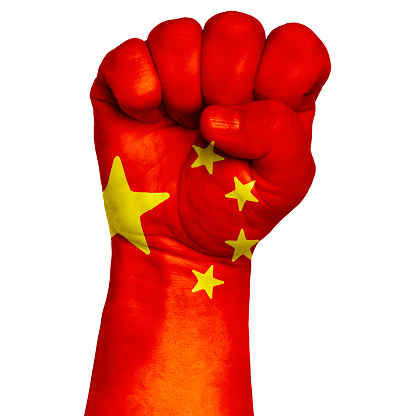China national flag painted onto a male clenched fist. Strength, Power, Protest concept