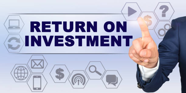 istock Businessman touching virtual screen with his finger. Screen caption - RETURN ON INVESTMENT 1257339152