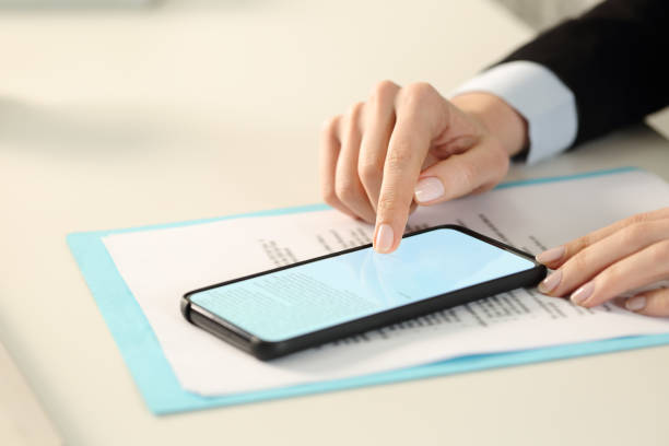 istock Executive hands signing digital contract on phone 1257340867