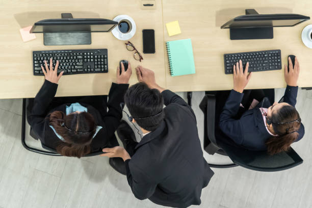 istock Business people wearing headset shot from top view 1257341654