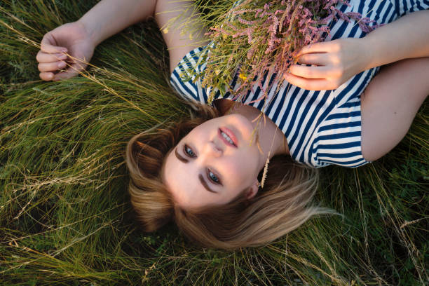 istock Walk in meadow on summer evening 1257342645
