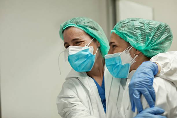istock Mature Female Doctors Taking a Break and Showing Support 1257342879