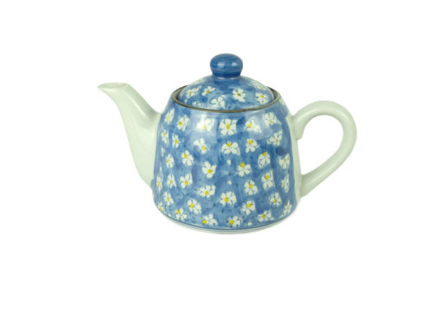 istock Light blue teapot with white flower pattern isolated on a white background. Asian food concept, space for text. 1257345707