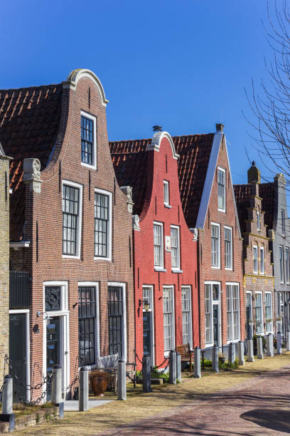 istock Old houses with clock gable in Harlingen 1257346774