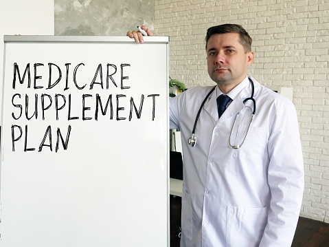 The doctor talks about medicare supplement plan in the clinic.