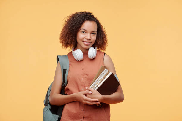 istock Student girl with books 1257354358
