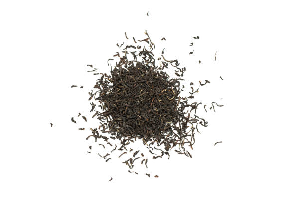 istock Fragrant Leaves of black premium dry tea on a white background 1257355681