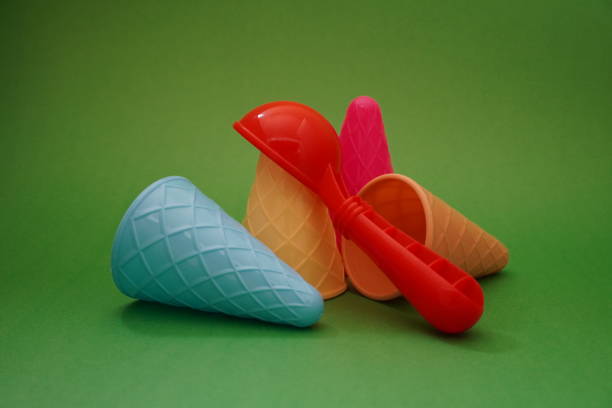 istock Plastic ice cream cones summer edition on a green background 1257357087