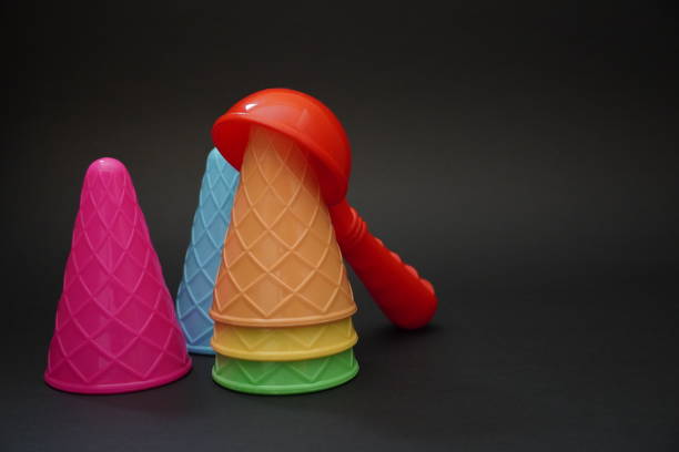 istock Colorful ice cream cone summer edition black background 1257357117