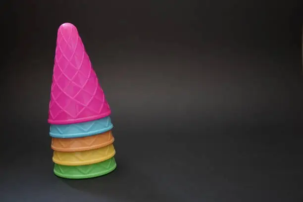 Colorful ice cream cone black background