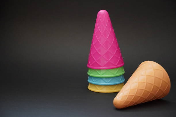 istock Colorful ice cream cone summer edition black background 1257357215