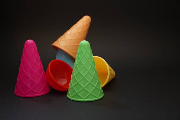 istock Colorful ice cream cone summer edition black background 1257357250