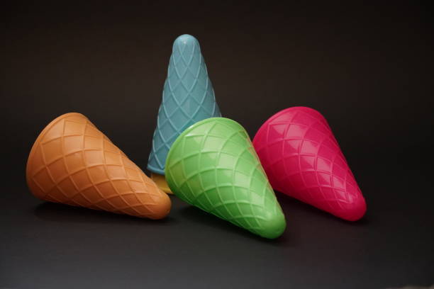istock Colorful ice cream cone summer edition black background 1257357318