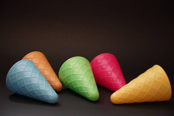 istock Colorful ice cream cone summer edition black background 1257357335