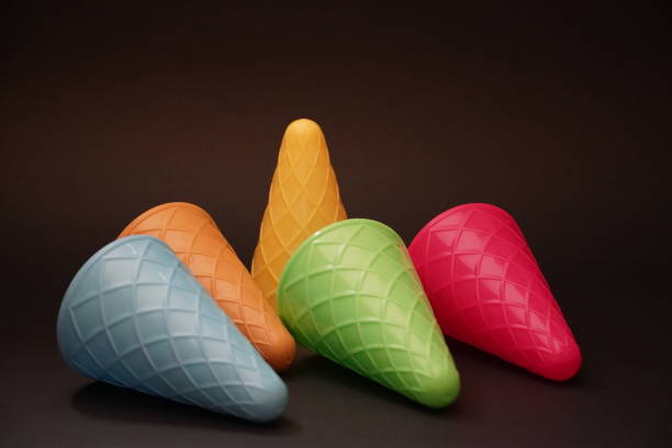 istock Colorful ice cream cone summer edition black background 1257357358