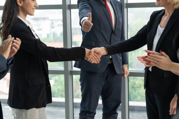 istock Business people handshake in corporate office 1257358116