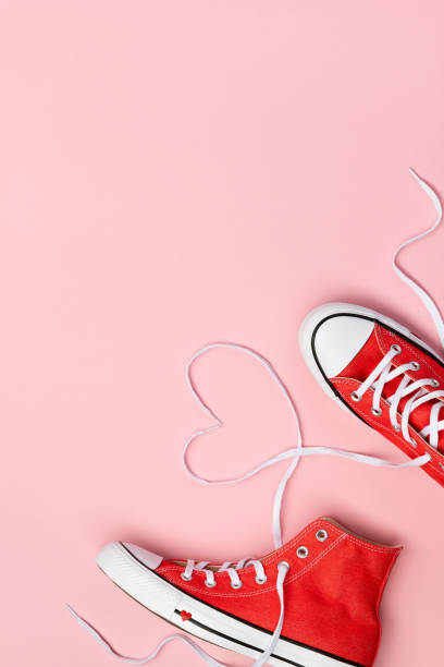 istock Minimal composition with red sneakers on pink background. 1257358305