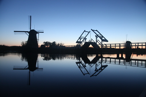 Dutch Holland windmill field canal sunset, Netherlands Holland