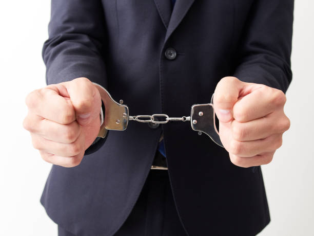 istock Japanese male businessman being arrested 1257359730