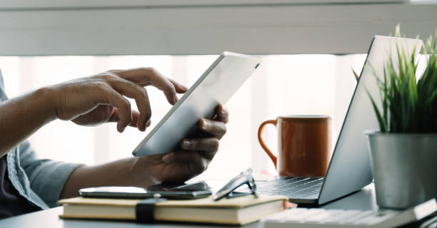 istock Close up man using smart laptop at home 1257359867