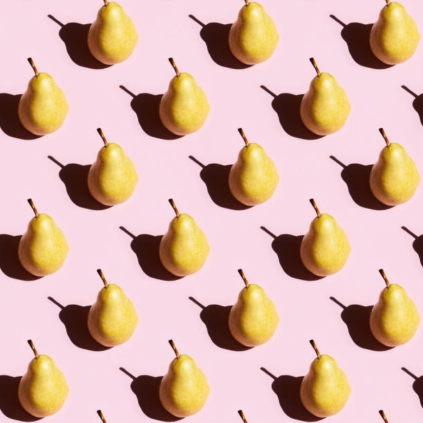 istock Seamless regular creative pattern of fruit pear with dark shadows. Printing on fabric, wrapping paper. 1257360563