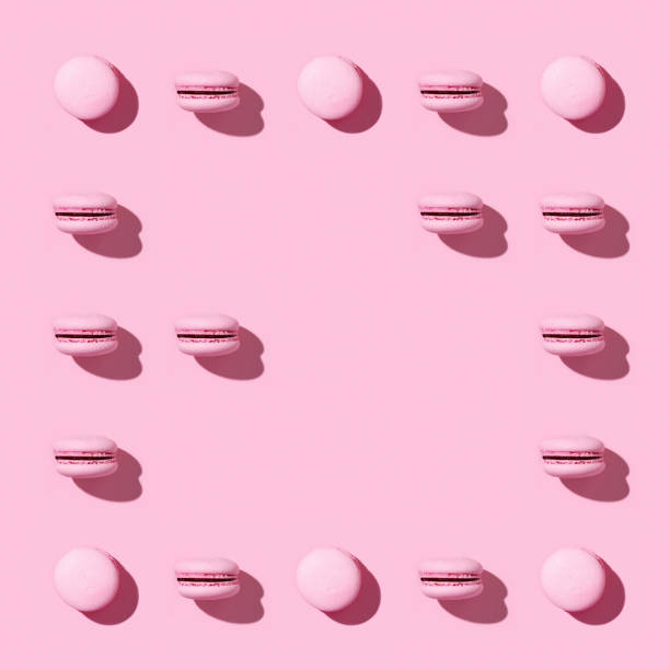 istock Creative frame of pink french cookies macarons 1257360571