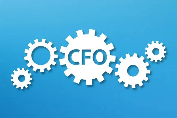 Photo of Chief Finance Officer, CFO concept with white gears on blue background