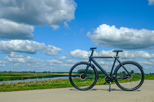 VanMoof S3 Ebike in a rural landscape. VanMoof is a Dutch bicycle producer of design bikes, now focussing on e-bikes with a minimalistic design.