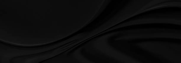 istock Black gray satin dark fabric texture luxurious shiny that is abstract silk cloth panorama background with patterns soft waves blur beautiful. 1257367578