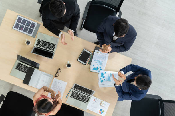 istock Successful business people celebrate together with joy 1257369238