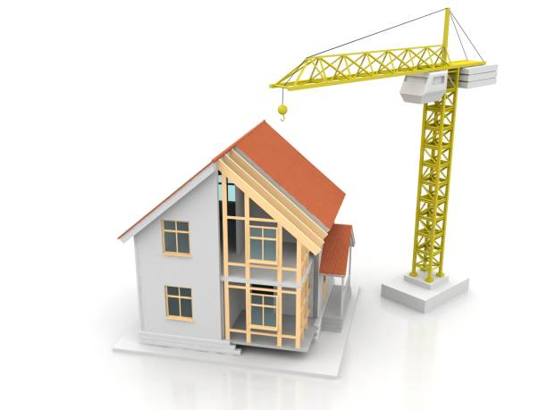 istock House 3d rendering illustration with open interior on top. Blueprints, documents, crane and mortgage calculations. 1257369608