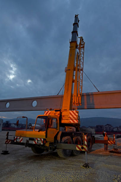 istock The crane lifts the concrete beam 1257373946