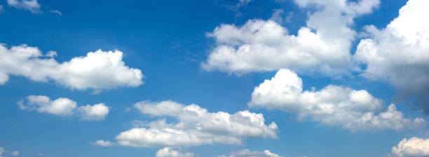 istock Wide banner with blue sky and white clouds. 1257375679