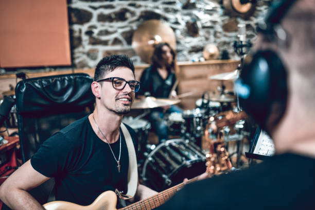 istock Band Recording Difficult Song Parts In Studio 1257378006