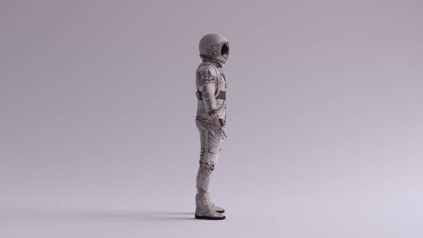 istock Retro Astronaut with Black Visor and Silver White Spacesuit With Light Grey Background with Neutral Diffused Side Lighting 1257378203