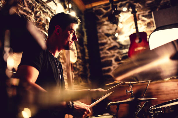 istock Drummer Grooving His Latest Song In The Studio 1257378464