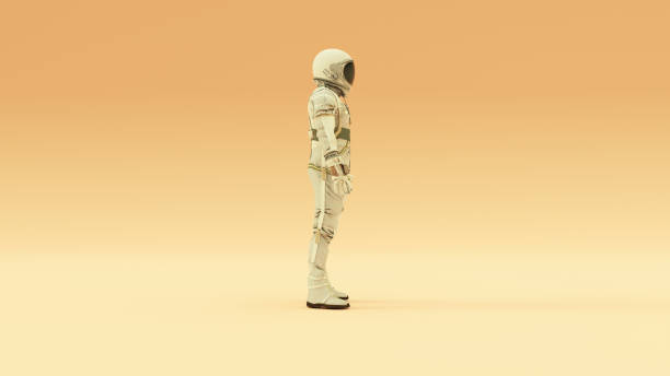 istock Retro Astronaut with Black Visor and Silver White Spacesuit With Light Grey Background With Warm Cream Background with Warm Diffused Lighting 1257378574