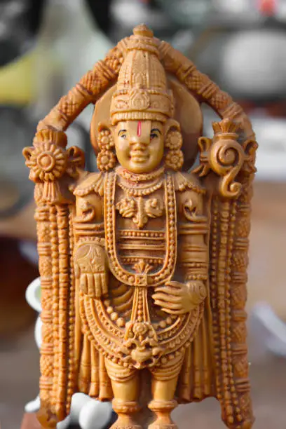 Photo of Colorful Painted Handcrafted Statue Of Indian Hindu Lord God Idol Sri Sreenathji Vishnu Tirupati Balaji Or Venkateswara Made Of Earthenware Mud Clay Stone Or Rock In Standing Position And Blessing Pose For Worship Pooja Puja In Festival And Celebrations