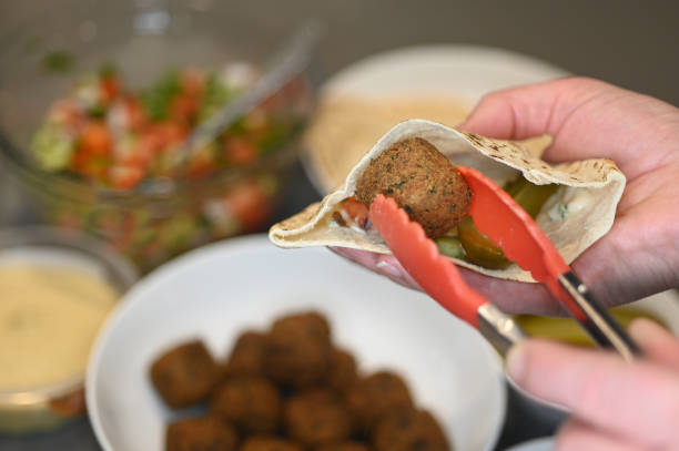 istock Pitta bread with falafel ball and Middle Eastern salads 1257383435