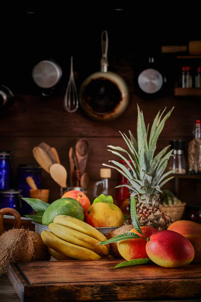 istock Group of ripe tropical fruits on a table in a rustic kitchen 1257384686