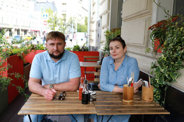 istock Couple on veranda of restaurant 1257384762