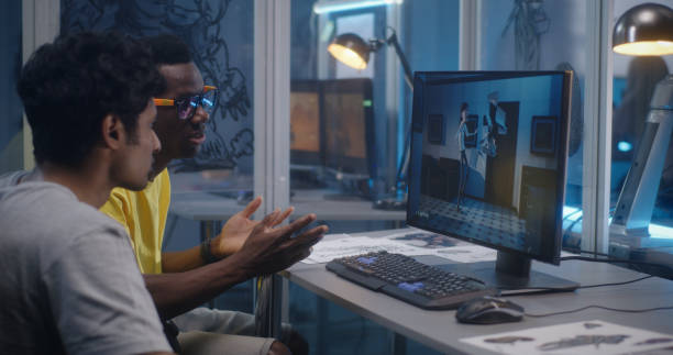 istock Designers discussing 3D modeling for video game 1257386165