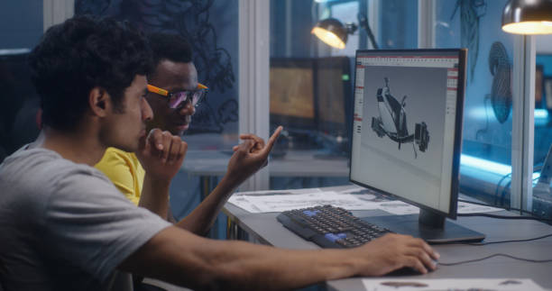 istock Designers discussing 3D modeling for video game 1257386197
