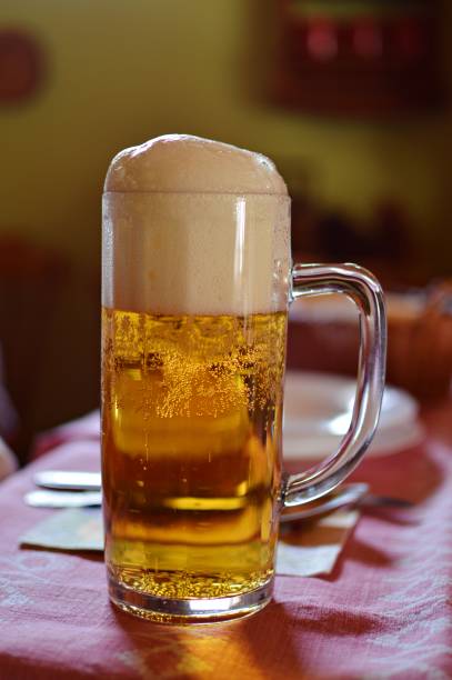 istock glass of light beer with foam 1257388491