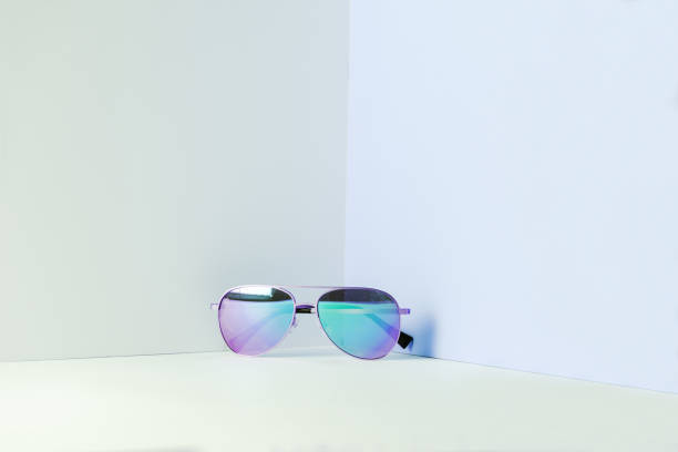istock Stylish blue aviator sunglasses on modern minimal background, front view. Nobody. 1257388842